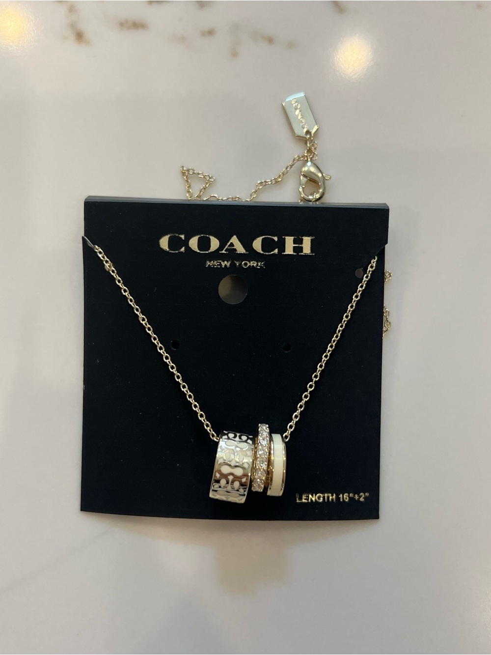 Coach Gold and White Ring Pendant Necklace